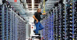 Google’s Roger Harris performs maintenance on equipment in one of the company’s data centers. (Photo: Google)