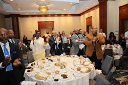 Attendees honor Norman Hill during a scholarship fundraising dinner hosted by IBEW Local 26 on May 2, 2024. (Source: IBEW Local 26)