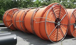 Large reels of 2-inch innerduct for a new fiber ring supporting the massive Quantum Loophole 'data center city' in Adamstown, Maryland.